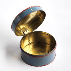 A neat little Edwardian tin collar box with a metallic gold interior and a hinged and fastened lid. The exterior has its original grey painted finish with red trim, and "Collars" in black painted lettering on top. Year of manufacture: c.1900.