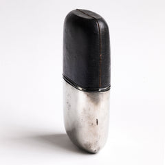 A very handsome Edwardian silver plated, glass and black leather 1/2 pint hip flask with a screw-cap top by "James Dickson & Sons Sheffield". The clear glass body is half covered with leather, the upper half has a detachable silver plated cover that also acts as a cup.