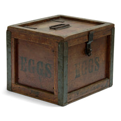 A very handsome 1920s egg travelling box, recently purchased from a farm sale in Hertfordshire, UK. The lid, and all four side panels are stencilled "Eggs", and various extra stamps, as shown in the images. It has a bracket hinged lid with carrying handle, reinforced metal trim corners, and a hasp. Inside the lid it still has its original maker's paper label, applied by the "Dairy Outfit Company Ltd, Kings Cross, London N1".