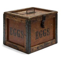 A 1920s egg travelling box, once used at Ewart Hebdish South Somerset Poultry Farm, Martock, Somerset, UK - as stamped on the lid. All four side panels and the lid are stencilled "Eggs", and various extra stamps, as shown in the images. It has a bracket hinged lid with carrying handle, reinforced metal trim corners, and a hasp. Inside the lid it still has its original maker's paper label, applied by the "Dairy Outfit Company Ltd, Kings Cross, London N1"