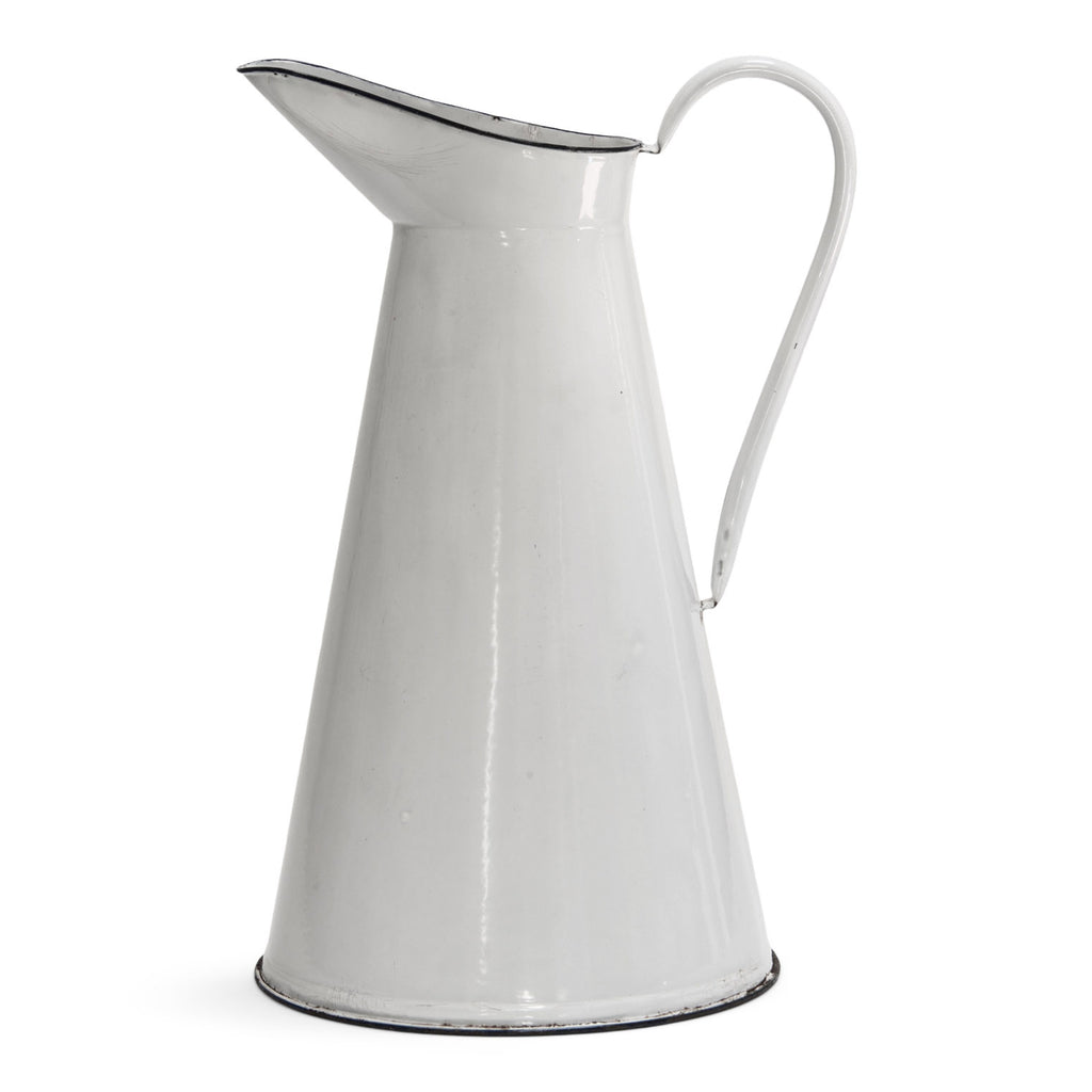 A good-looking large white enamel water jug with black enamel trim to its rim and base.   Year of manufacture: c.1930 - 1950  Origin: England   Material: enamelware  Height: 155cm  Diameter: 26cm  Diameter from spout to handle: 31cm
