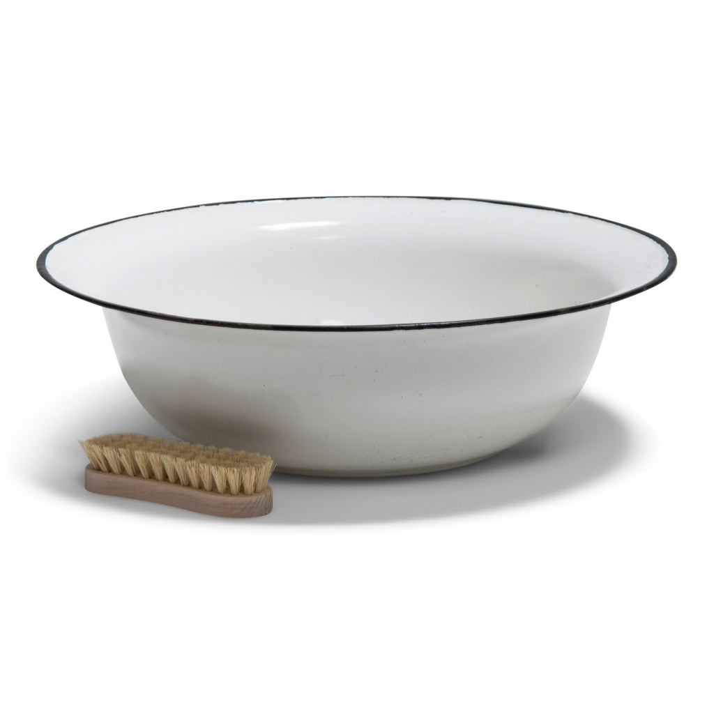 An extra-large white enamel bowl with black rim.