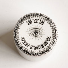 A rare Antique Edwardian ironstone eye ointment pot with over-glazed transfer print of an eye, "Eye Ointment" and a decorative border - and in immaculate condition.