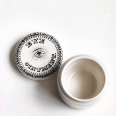 A rare Antique Edwardian ironstone eye ointment pot with over-glazed transfer print of an eye, "Eye Ointment" and a decorative border - and in immaculate condition.