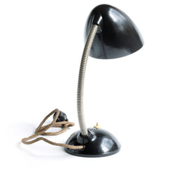 A stunning 1940s Bakelite lamp with flexi-arm designed by British designer Eric Kirkman Cole. It emits good directional light and so is ideal for the desk or the bedside table.
