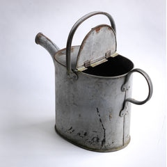 A handsome and downright useful early twentieth century water carrying can with a hinged lid. It would have originally been used to fill basins or baths with hot water, before the days of universal plumbing. Now it makes the perfect&nbsp;indoor watering can for houseplants or pot plants on the terrace.