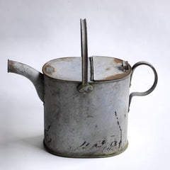 A handsome and downright useful early twentieth century water carrying can with a hinged lid. It would have originally been used to fill basins or baths with hot water, before the days of universal plumbing. Now it makes the perfect&nbsp;indoor watering can for houseplants or pot plants on the terrace.