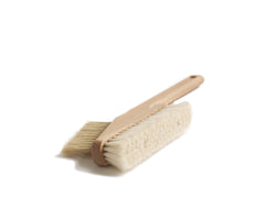 A computer cleaning brush with a long wooden handle and two types of bristles, soft and stiff, for cleaning laptops and other office equipment.