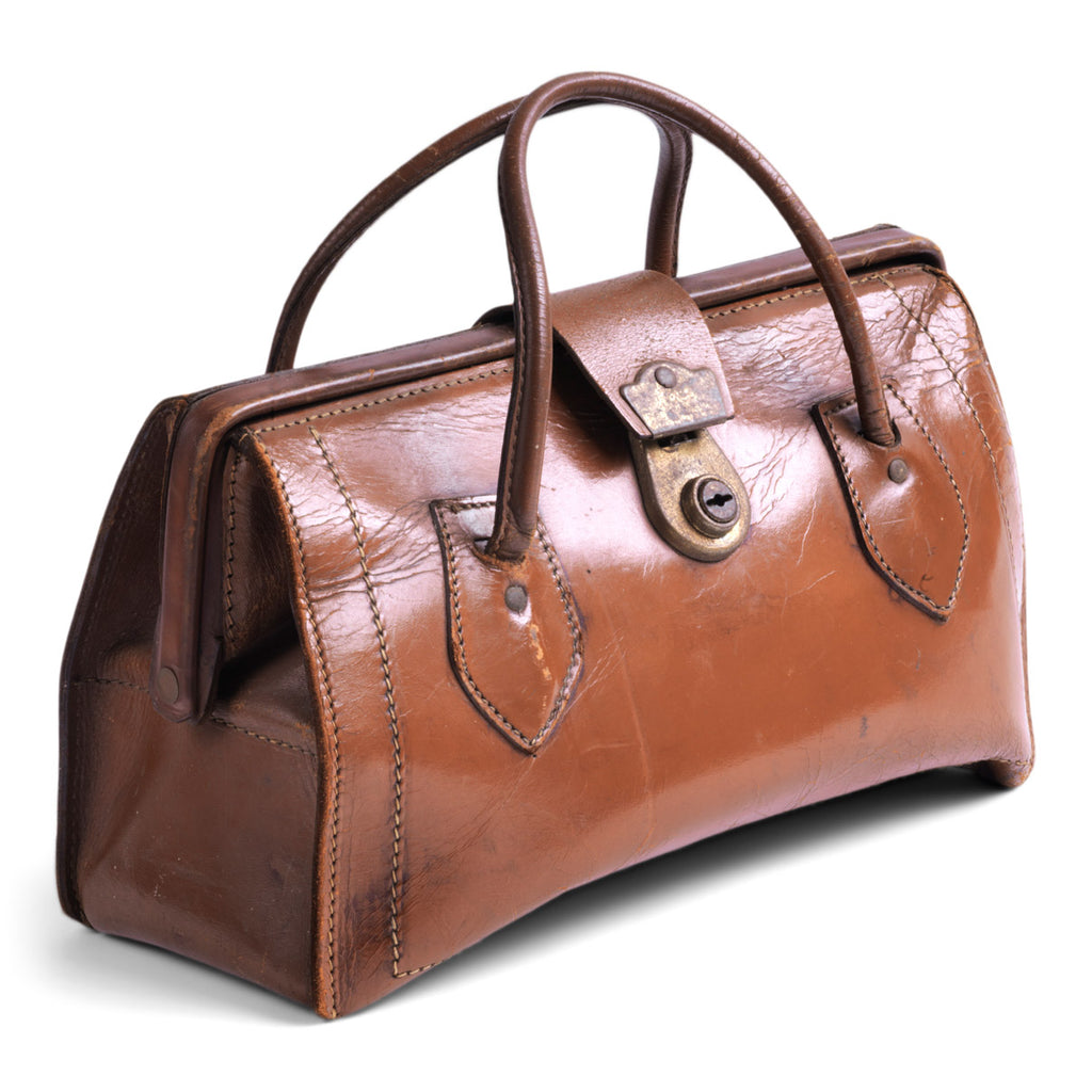 A small vintage brown leather holdall handbag