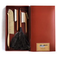 A collection of handmade brushes packed into a gift box that includes a computer brush and an ostrich feather duster.
