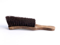 A handsome war office boot brush made of natural bristle and beech wood, and stamped with a broad arrow that denotes its military use.