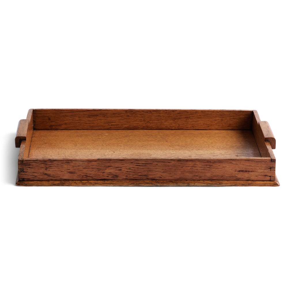 A handsome 1930s oak tea tray with straight-sided gallery and grip handles.