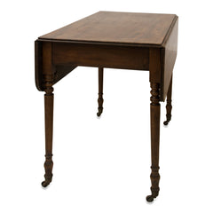 An elegant early Victorian mahogany Pembroke table with single drawer on four turned legs set on castors. A very handy and compact piece of furniture for the smaller home: when part extended it can be used as a desk or for supper for two; fully extended it can seat several people for dinner; and when fully collapsed it can act as a hall or side table.