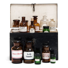 A collection of early twentieth century small-sized pharmacy bottles, in amber, clear and green glass. There are 13 bottles in total and all are with original chemist’s labels - some are from D Davies & Co, Caledonian Road, London N1.