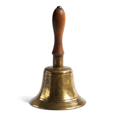 A very handsome large Edwardian school bell or porter's bell with a polished turned wood handle. It could have been used at a desk, hotel or boarding house reception, yet most likely used to call boarding school pupils back to lessons or in for tea. These days it provides the perfectly poetic way of summoning your family to the supper table.
