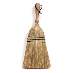 A traditional rice straw hand brush with a wooden handle and natural beige-colored bristles.