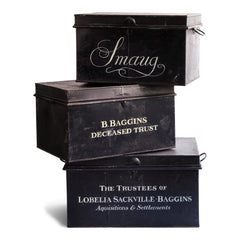 Three ex-window display Edwardian document trunks each sign-written with characters from The Hobbit, the child's fantasy novel by J R R Tolkien: Smaug, Bilbo Baggins and Lobelia Sackville Baggins.
