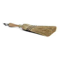 A traditional rice straw hand brush with a wooden handle and natural beige-colored bristles.