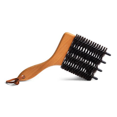 A brush designed to clean Venetian blinds made from all natural products, beechwood and goat hair, and with a handy leather strap for hanging.