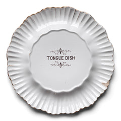 An antique butcher's cooked tongue counter top display plate with a deep fluted border, the centre with transfer "Tongue Dish" dating to the turn of the last century. Country of origin: UK Date of manufacture: c.1900 Material: ironstone ceramic Dimensions: Diameter 27cm Height 3cm