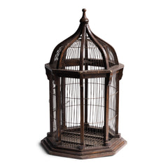 A very elegant Victorian architectural cupola shaped bird cage with original wiring and painted finish. The base is constructed from wood and supports eight wooden columns which in turn anchor the fine wire cage work - and its dome is topped with a turned finial. The cage is also fitted with a sprung wire hatch for access, and a base that is hinged for cleaning purposes.