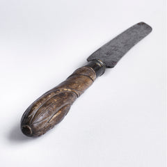 A Victorian bread knife with carved sycamore handle, and carbon steel engraved blade by "Taylor Whitners Sheffield". The handle has a spiralled wheat sheaf and "Bread" carved decoration. 