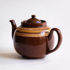 A good 6 cup original Brown Betty teapot with mustard and brown banding.