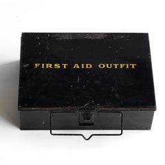 A good-looking 1920s first aid tin, the lid stencilled "First Aid Outfit". It has a carrying handle and fastening hasp, and it has its original black enamel paint finish.  
