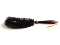 A handy brush with an oval bristle arrangement, and excellent for dealing with all those awkward nooks and crannies around the home. It has a polished painted wood handle, and handy hanging loop - and was made by "Kleen-e-ze" in the 1930s. 