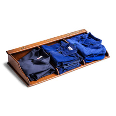 A collection of cobalt-blue, denim-blue and grey cotton vintage French work jackets.