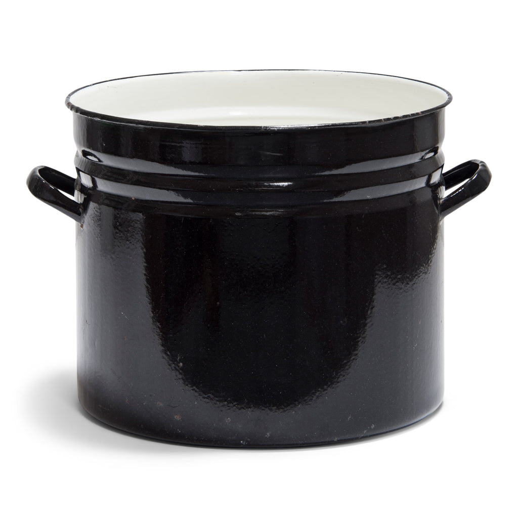 An extra-large industrial black and cream enamel pan that would make a wonderful wastepaper bin, workshop dustbin or shed tidy for holding potting compost or all those bits and bobs that need a handsome home. It also makes a stunning houseplant pot holder.