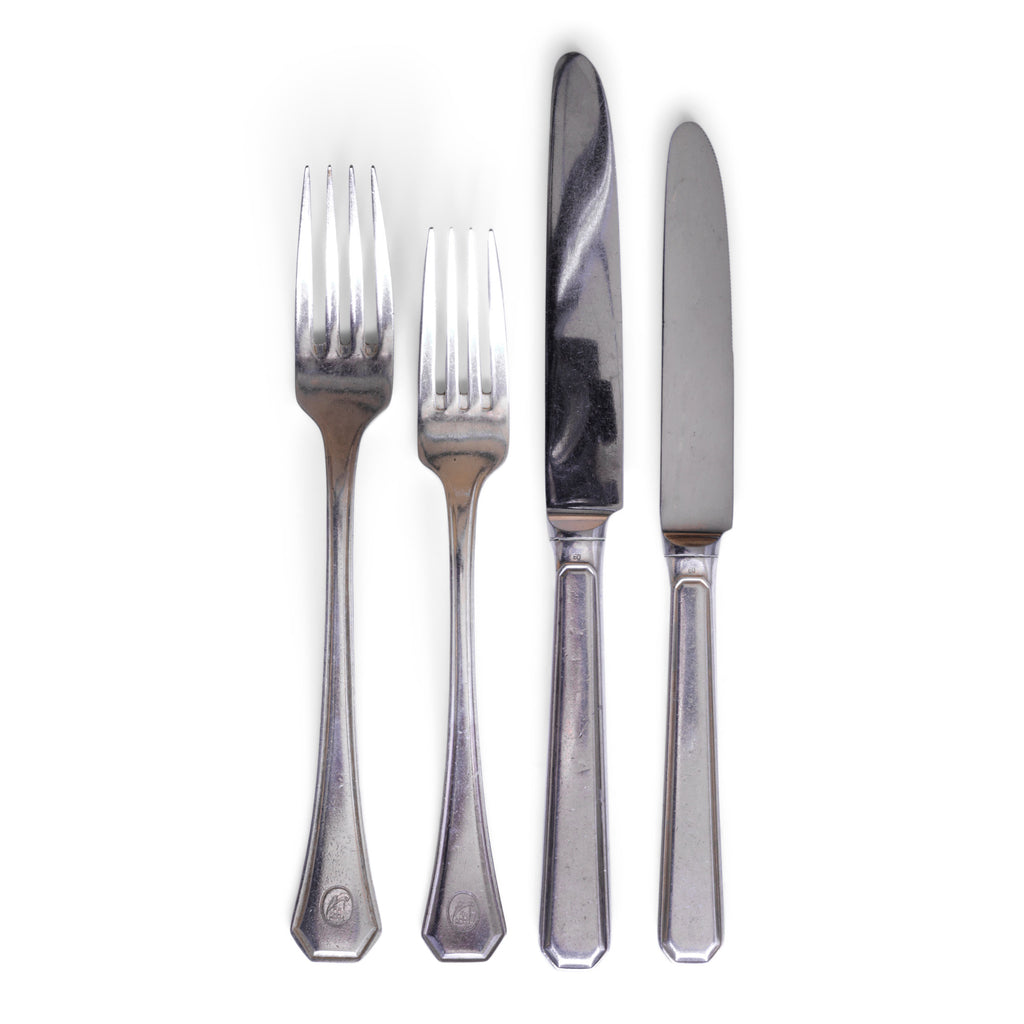 Vintage hotel ware silver-plated WMF knives and forks, made for Holland & America Line, the cruise liner company