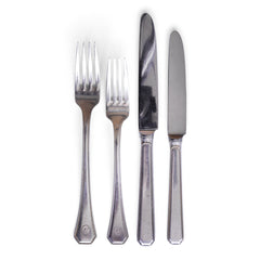 Vintage hotel ware silver-plated WMF knives and forks, made for Holland & America Line, the cruise liner company
