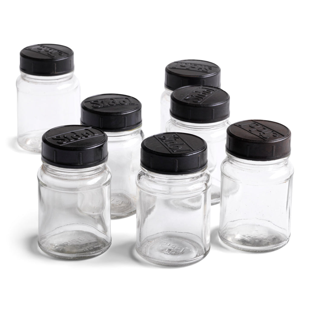 Our glass jars have Bakelite lids, and each is moulded with the name "Sidol". The jars make perfect spice containers and look very pleasing when grouped together. 