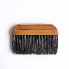 Once used as a wallpaper brush, this handy little brush is just at home being used in conjunction with a dustpan or as a tabletop crumb brush.