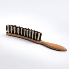 A good-looking early twentieth century hatter's advertising brush made from beech wood and twin-tone horsehair, arranged like a zebra's mane. The brush bears the proprietors name and address "James Stewart, Hatter, 142, Argyle St, Glasgow", and was probably given away to regular customers.