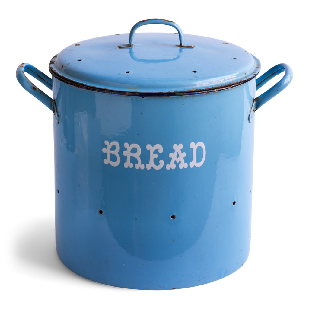 A good-sized vintage Edwardian blue enamel bread bin with original lid and wonderful "Bread" typeface in white enamel. This bin is early, has a good weight, and its lid and sides have a circle of pierced holes, to allow for air flow, as was the way with late nineteenth century/early twentieth century enamel bread bins.