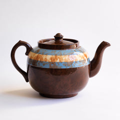 A rare colour-way 6 cup original Brown Betty teapot with blue and white marbled banding.