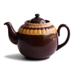 A good large 6 cup original Brown Betty teapot with mustard banding and raised pie-crust style fluting.