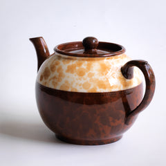 A good 4 cup original Brown Betty teapot with a deep marbled band, along with a fine beaded relief between the marbled band and main body of the teapot. 
