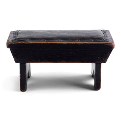 A handsome 1920s stained pine little foot stool with a cushioned leatherette top. We wouldn't recommend standing on it, yet it's ideal for shoe cleaning, propping your feet upon when enjoying a snooze, or it could be used as a very low-level side table. Origin: UK