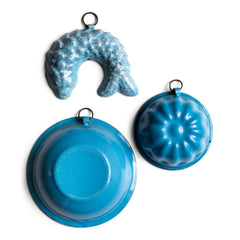 Two very pleasing antique miniature blue enamel food moulds: a jelly mould and a fish aspic jelly mould; and both with hanging rings. These are part of an extensive collection of miniature pale blue enamel kitchen ware, previously owned by the miniaturist specialist and collector extraordinaire Joan Dunk.
