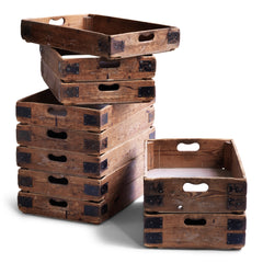 We have just ten of these wonderful vintage potter's crates. Once used in the Staffordshire potteries for transportation of greenware (unfired ceramics) to the kiln, each pine potter's tray has time-worn slot handles, metal corner braces, and a plywood base. They are great for home storage, as they can be stacked one on top of the other, and would work well in the kitchen, office or shed as sliding drawers under a table or other work surface. 
