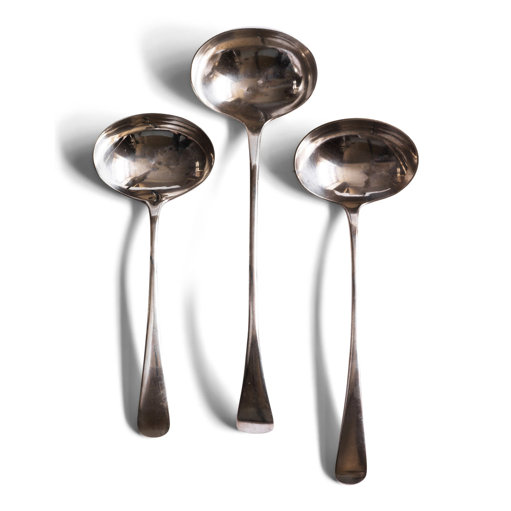 A collection of three silver-plated ladles These well-proportioned and beautifully designed ladles have elegant bow-arched handles and would sit well alongside a tureen of soup or bowl of festive punch.