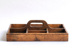 A well proportioned antique stained pine housekeeper's tidy with integrated handle. It could also be used to house utensils, tools, artist's materials or act as a shoe cleaning box. In fact it's totally purposeful.