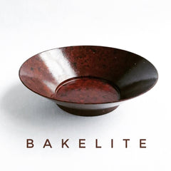 A 1930s Bakelite fruit bowl with straight sides and raised foot, and an excellent example of early twentieth century Modernism. As a design principle Modernism promoted sleek, clean lines and eliminated decorative additions that were purely for the sake of embellishment. It was a new world that took its forms from technology, factories, practicality and usefulness. Form certainly follows function in the design and material that was used to make this bowl.