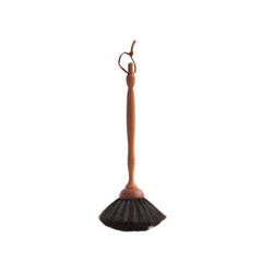Our highly tactile handmade dusting brush has a pom-pom of soft goat's hair that is hand-tufted onto a turned pear wood handle. This brush is ideal for all your extra delicate dusting needs, such as around ornaments, glass and delicate light fittings, such as chandeliers.  It is a beautiful brush, and you may not want to use it but simply hang it up by its leather strap and give it an occasional fondle. The small spot of white goat's hair gives it its name.