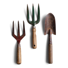 Two good quality vintage garden hand forks and a trowel, with polished wooden handles and original paint.